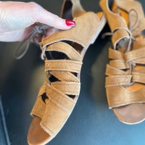 Brown suede lace up sandals.